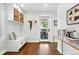 Bright mudroom features custom built-in bench with storage and stylish decor at 474 S Vine St, Denver, CO 80209