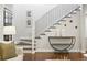 Elegant staircase with iron railings and hardwood floors, complemented by stylish decor at 474 S Vine St, Denver, CO 80209