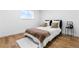 A bright bedroom showcases a comfortable bed with soft textiles, complemented by a stylish side table at 9565 W Lake Pl, Littleton, CO 80123
