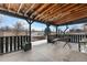 Cozy covered patio with outdoor seating, perfect for relaxing or entertaining at 9565 W Lake Pl, Littleton, CO 80123