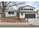 Charming home with a well-manicured front yard, showcasing its inviting curb appeal at 9565 W Lake Pl, Littleton, CO 80123