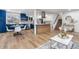 Contemporary kitchen with white countertops, dining area, and open access to the living room at 9565 W Lake Pl, Littleton, CO 80123