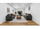 A cozy living room with a decorative fireplace, comfortable seating, and stylish decor, perfect for relaxation at 9565 W Lake Pl, Littleton, CO 80123