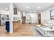 Bright and airy living space flowing into a modern kitchen, enhanced by natural light at 9565 W Lake Pl, Littleton, CO 80123