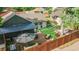 Aerial view of fenced backyard with deck, patio, and manicured synthetic lawn at 2990 S Sherman St, Englewood, CO 80113