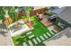 Aerial view of backyard features bar, patio, and synthetic grass at 2990 S Sherman St, Englewood, CO 80113