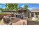 Outdoor living space with bar, lounge seating, and privacy fence at 2990 S Sherman St, Englewood, CO 80113