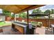 Outdoor back deck features bar seating, mounted lighting, and modern decor at 2990 S Sherman St, Englewood, CO 80113