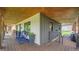 Inviting back porch features comfortable seating and stylish decor at 2990 S Sherman St, Englewood, CO 80113