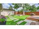 Back yard offers green space, stone pavers, and an outdoor seating area at 2990 S Sherman St, Englewood, CO 80113