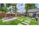 The backyard features a deck, patio, and synthetic grass at 2990 S Sherman St, Englewood, CO 80113