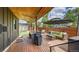 Relaxing backyard deck boasts outdoor seating and shaded lounge area at 2990 S Sherman St, Englewood, CO 80113