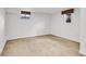 Carpeted basement room with neutral walls and window at 2990 S Sherman St, Englewood, CO 80113