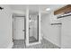 Modern basement bathroom features a tiled shower and elegant fixtures at 2990 S Sherman St, Englewood, CO 80113