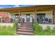 Inviting front porch with seating area and updated trim at 2990 S Sherman St, Englewood, CO 80113