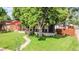 Charming home featuring a large front yard, covered porch, and mature tree at 2990 S Sherman St, Englewood, CO 80113