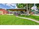 Charming single-story home featuring a welcoming front porch and lush green lawn at 2990 S Sherman St, Englewood, CO 80113