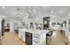 Open-concept kitchen flows into the living room, creating a seamless space for entertaining and modern living at 2990 S Sherman St, Englewood, CO 80113
