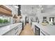Beautiful kitchen featuring stainless steel appliances, modern backsplash, and an open concept layout at 2990 S Sherman St, Englewood, CO 80113