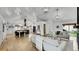 Open-concept living room featuring recessed lighting and hardwood floors, bathed in natural light at 2990 S Sherman St, Englewood, CO 80113