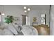 This spacious main bedroom features hardwood floors, stylish lighting, and neutral walls at 2990 S Sherman St, Englewood, CO 80113