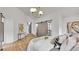 This main bedroom features an ensuite bathroom, hardwood floors, and barn door access to a closet at 2990 S Sherman St, Englewood, CO 80113