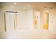Bright basement featuring plush carpeting, recessed lighting, and access to a full bathroom at 7961 Jared Way, Littleton, CO 80125