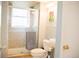 Bathroom with a glass enclosed shower and a stylish sink and toilet at 7961 Jared Way, Littleton, CO 80125