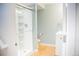 Bathroom with a modern white shower with glass door, and a floating vanity at 7961 Jared Way, Littleton, CO 80125