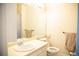 Bright bathroom featuring a large mirror, ample counter space, and essential fixtures at 7961 Jared Way, Littleton, CO 80125