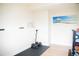 Workout room with dumbbells, workout mat, and a mini fridge at 7961 Jared Way, Littleton, CO 80125