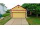 Picture of the two-car garage and driveway of this quaint single Gathering home at 7961 Jared Way, Littleton, CO 80125