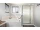 Bathroom features a soaking tub and glass-enclosed shower with tiled accents at 4950 Mt Cameron Dr, Brighton, CO 80601