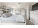 Spacious bedroom with a ceiling fan, and views of the ensuite bath and closet at 4950 Mt Cameron Dr, Brighton, CO 80601