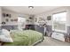 This room has toys and decorations on the shelves, two windows, and carpeted floors at 4950 Mt Cameron Dr, Brighton, CO 80601