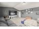 Comfortable living room with a large TV and ample space for entertaining at 4950 Mt Cameron Dr, Brighton, CO 80601