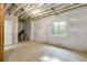 Spacious unfinished basement featuring insulated walls, exposed ceiling and a window, ready for customization at 16778 W 93Rd Pl, Arvada, CO 80007