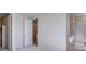 This bedroom features neutral walls and carpet with an ensuite bathroom and closet at 16778 W 93Rd Pl, Arvada, CO 80007