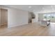 Inviting open living space with modern floors and windows, seamlessly connecting to the kitchen at 16778 W 93Rd Pl, Arvada, CO 80007