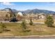 Neighborhood view showcasing nearby houses, a playground, and surrounding mountain views at 16778 W 93Rd Pl, Arvada, CO 80007