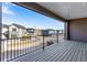 Outdoor patio showcasing neighborhood with modernly designed townhomes under a blue sky at 16778 W 93Rd Pl, Arvada, CO 80007