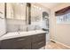 Beautiful bathroom with dual sinks, modern cabinets, and stylish subway tile backsplash at 4666 Cornish Way, Denver, CO 80239