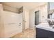 Well-lit bathroom featuring a tub, shower, modern sink, and updated fixtures at 4666 Cornish Way, Denver, CO 80239