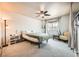 Bright bedroom featuring neutral walls, carpet flooring, and a ceiling fan at 4666 Cornish Way, Denver, CO 80239