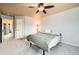 Comfortable bedroom featuring carpet flooring, a ceiling fan, and neutral walls at 4666 Cornish Way, Denver, CO 80239