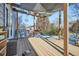 Wood deck with partial shade covering overlooking the landscaped backyard at 4666 Cornish Way, Denver, CO 80239