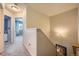 Hallway featuring gray carpet, neutral walls, and doorway to an adjacent room at 4666 Cornish Way, Denver, CO 80239