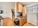 Open kitchen with wooden cabinets and stone countertops at 4666 Cornish Way, Denver, CO 80239