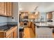 A bright kitchen with an island, gray backsplash, and updated stainless steel appliances at 4666 Cornish Way, Denver, CO 80239