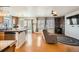 Inviting living area with hardwood floors, a cozy stone fireplace, and plenty of natural light at 4666 Cornish Way, Denver, CO 80239